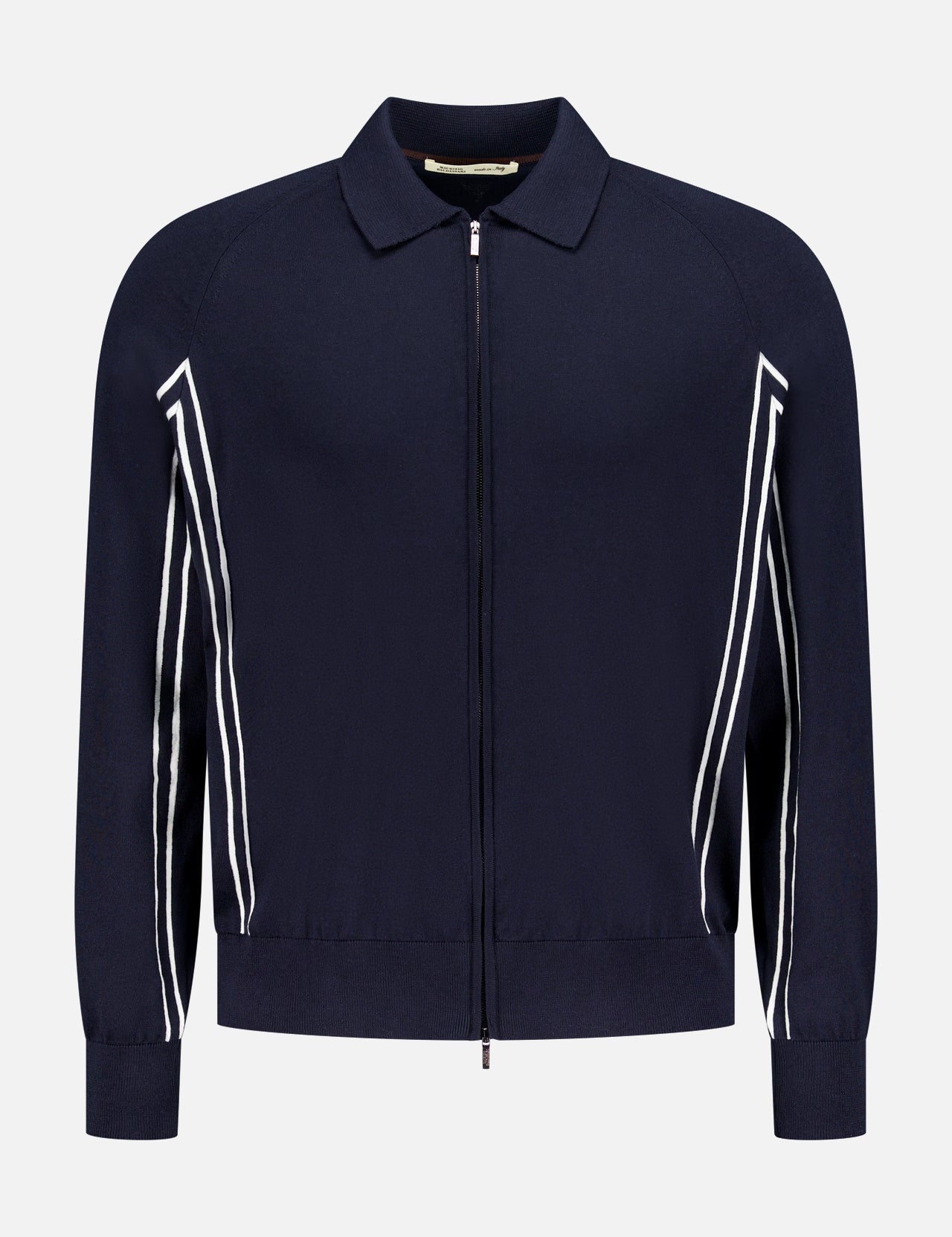 The Tennis Details Zip Sweater by MAURIZIO BALDASSARI is a navy zip-up with a collar, long sleeves, and white diagonal stripes. Made in Italy, it features a minimal design with ribbed cuffs and hem.