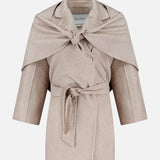 MAX MARA’s Long Cashmere Jacket with Bonus Scarf in light beige features a knee-length silhouette, self-tie belt, wide lapels, and a draped cape detail over the shoulders. Expertly crafted in Italy, it is displayed against a white background.