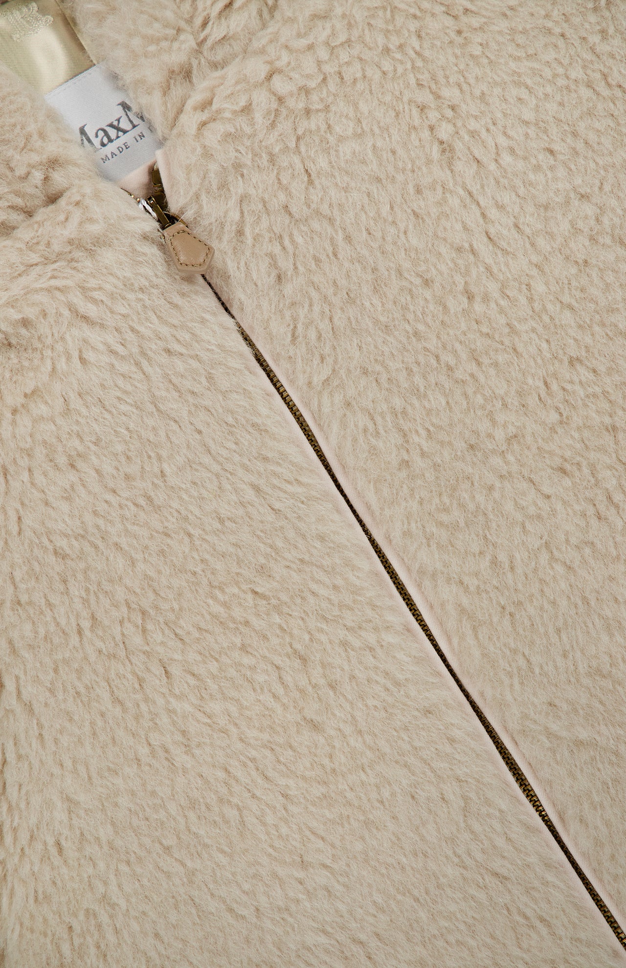 Close-up of a beige Max Mara Teddy Hooded Coat with a hood and a central front zipper.