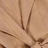 Close-up of a camel-colored MAX MARA Wrap Trench Coat with a belted wrap design and notched lapels.
