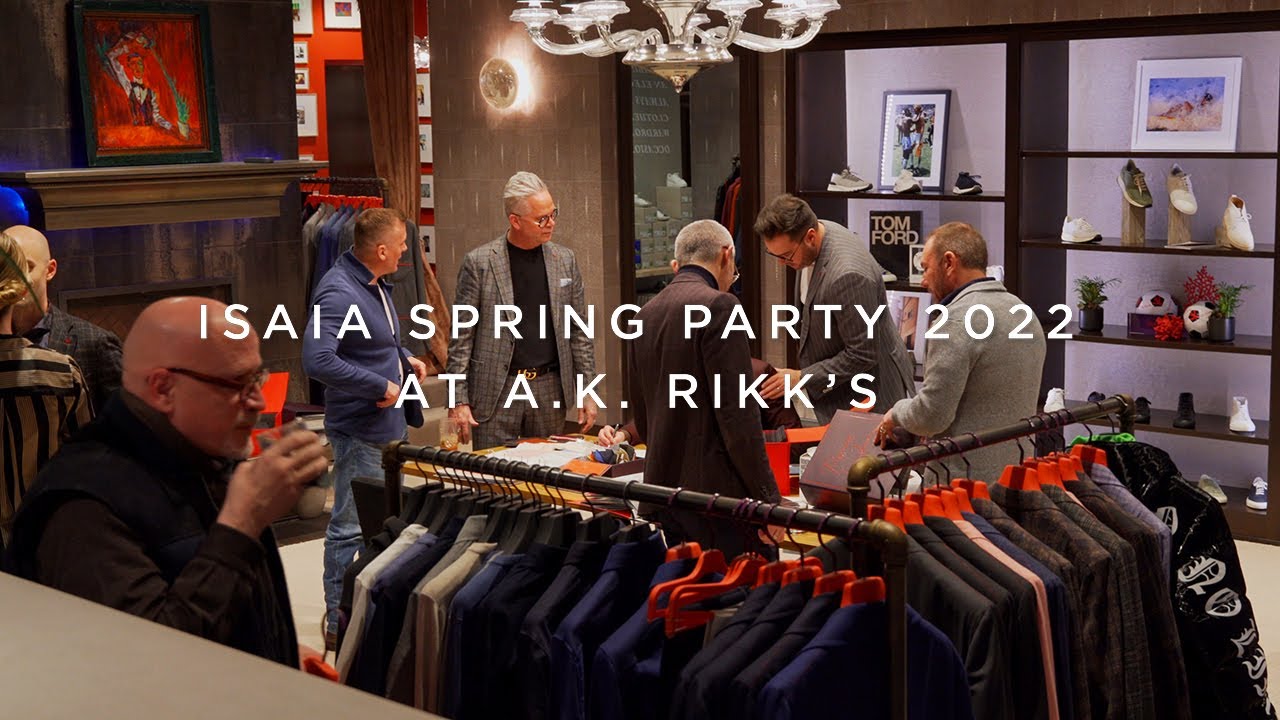 image with text "Isaia Spring Party 2022 at A.K. Rikk's" image is of clients shopping Isaia at our in-store installation for ready-to-wear and made-to-measure 