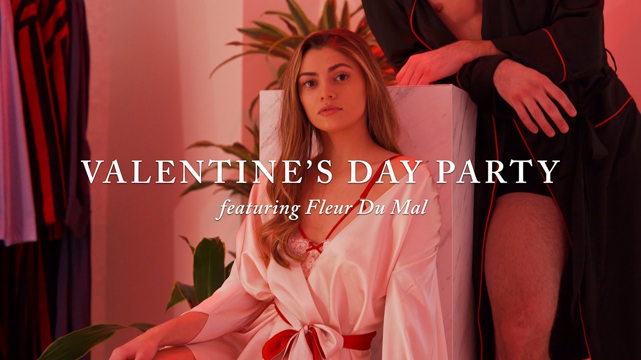 image with text "Valentine's Day Party featuring Fluer Du Mal" image is of a male and female model posing in Fluer Du Mal lingerie and robes