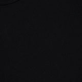 Close-up of the Merz B. Schwanen Cotton Thermal Long Sleeve T-shirt in black, showcasing a textured crewneck and a visible white collar tag displaying the brand name and size M for medium. Made from organic cotton, this timeless piece offers exceptional comfort and quality.