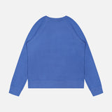 The Merz B. Schwanen Light Weight Crewneck Sweatshirt in blue, featuring long sleeves and a crew neck, is shown laid flat from the back on a white background.