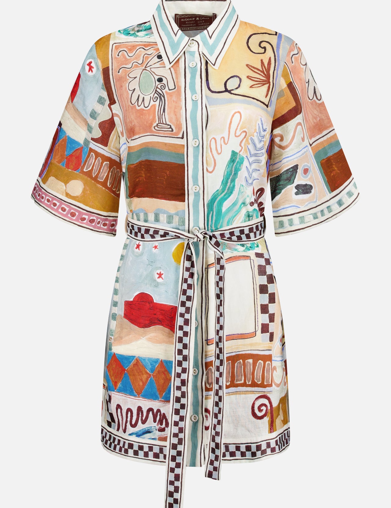 The Michelle Linen Mini Dress by ALEMAIS is a short-sleeved collared shirtdress with a tie belt, showcasing a colorful abstract pattern of geometric shapes and nature motifs in earthy tones, inspired by an artist collaboration.