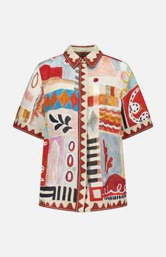 The Michelle Relaxed Linen Shirt by ALEMAIS features a relaxed fit and an abstract, colorful print with geometric shapes and organic forms in red, orange, blue, black, and beige—a collaboration with artist LRNCE Laurence Leenaert.