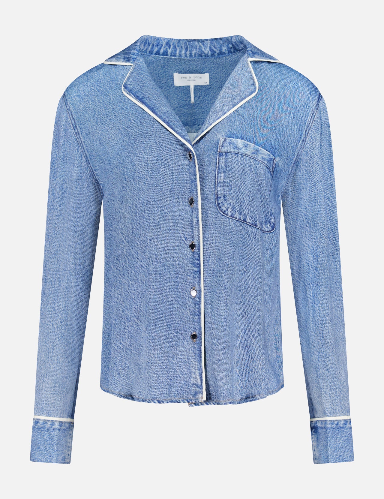 The RAG & BONE Miramar Slink Long Sleeve Lounge Shirt features blue denim-look fabric with white piping on the collar, cuffs, and pocket, a single chest pocket, black buttons, and soft fluid construction. Shown on a plain white background.