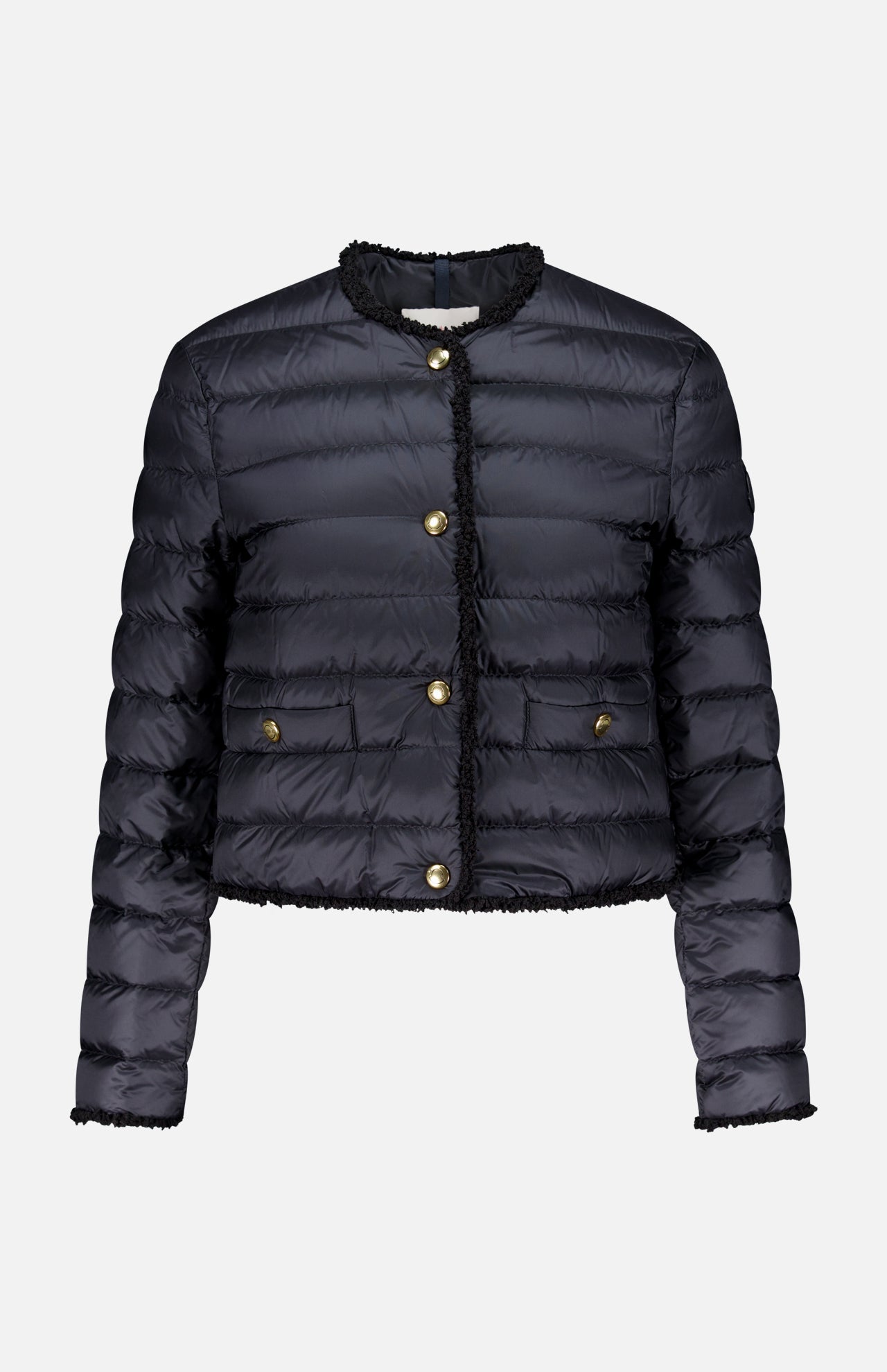 The Fleurs Bouclé Trim Jacket by MONCLER is a black, down-filled, quilted puffer with gold buttons, two front pockets, and no collar. It features long sleeves, is water-repellent, and shown against a plain white background.