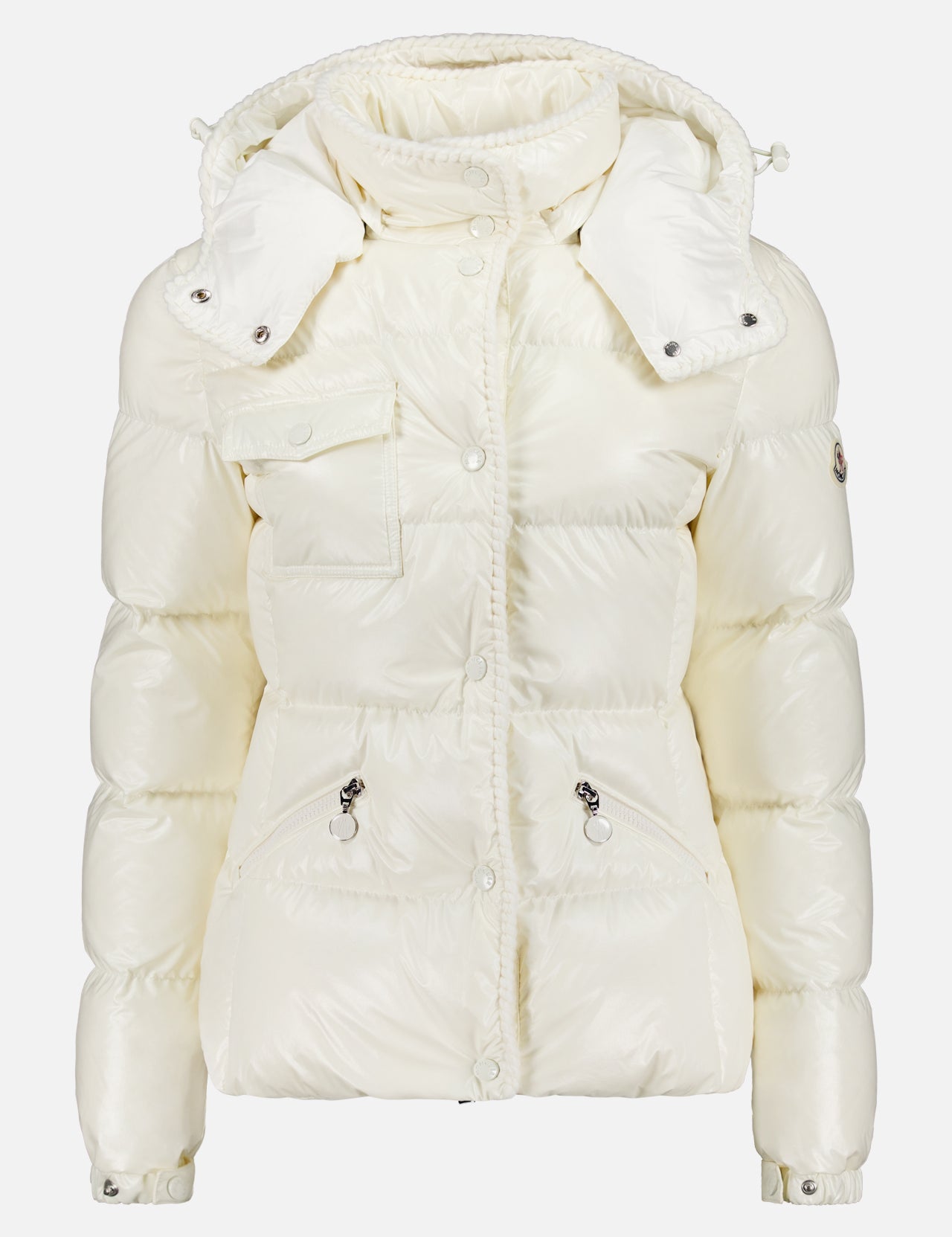 The MONCLER Glareins Glossy Puffer Jacket is a shiny white women’s nylon jacket with a hood, front zipper, snap buttons, chest and hip pockets, quilted insulation, and adjustable drawstrings at the hood and waist.