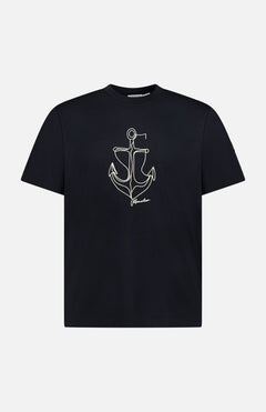 The MONCLER Anchor Graphic Short Sleeve T-shirt features a black design with a minimalist white anchor graphic and "freedom" text on the front.