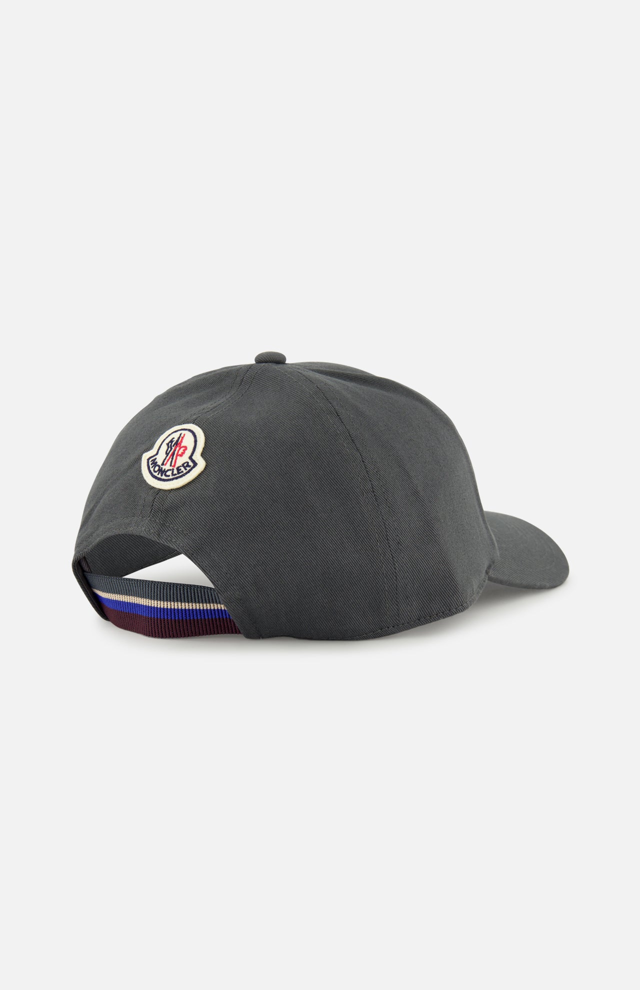 A dark grey MONCLER Monogram Baseball Cap seen from the back, featuring an embroidered logo above an adjustable strap with a blue, white, and red stripe—ideal for designer style fans.