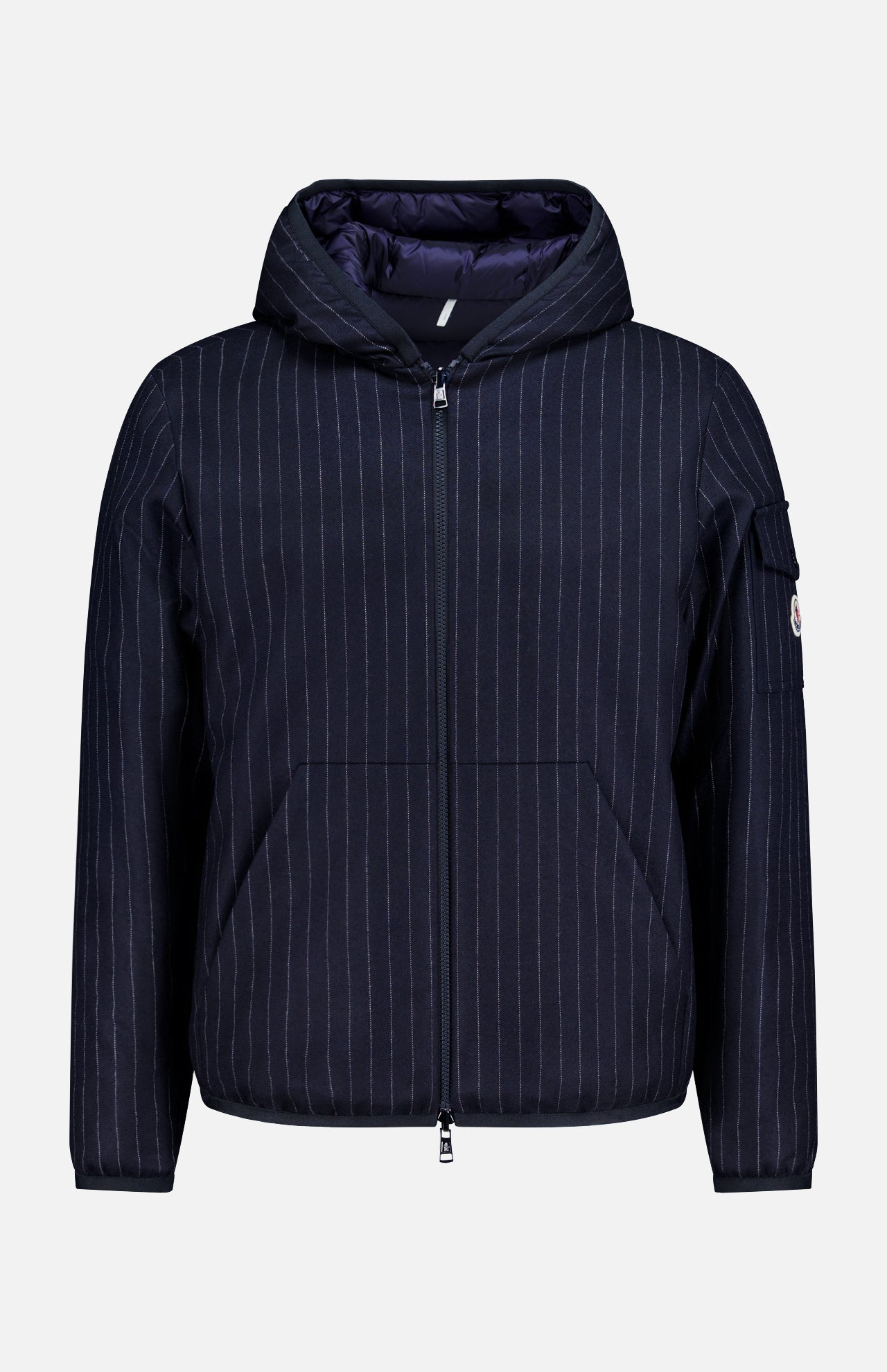 The MONCLER Ceze Striped Reversible Jacket features navy and white vertical pinstripes, a hood, front zipper closure, side pockets, and a zippered sleeve pocket, shown on a plain white background.