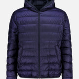 The MONCLER Ceze Striped Reversible Jacket features a dark purple exterior, black pinstriped interior, front zipper, horizontal quilting, side pockets, and an attached hood. The jacket is shown against a plain white background.