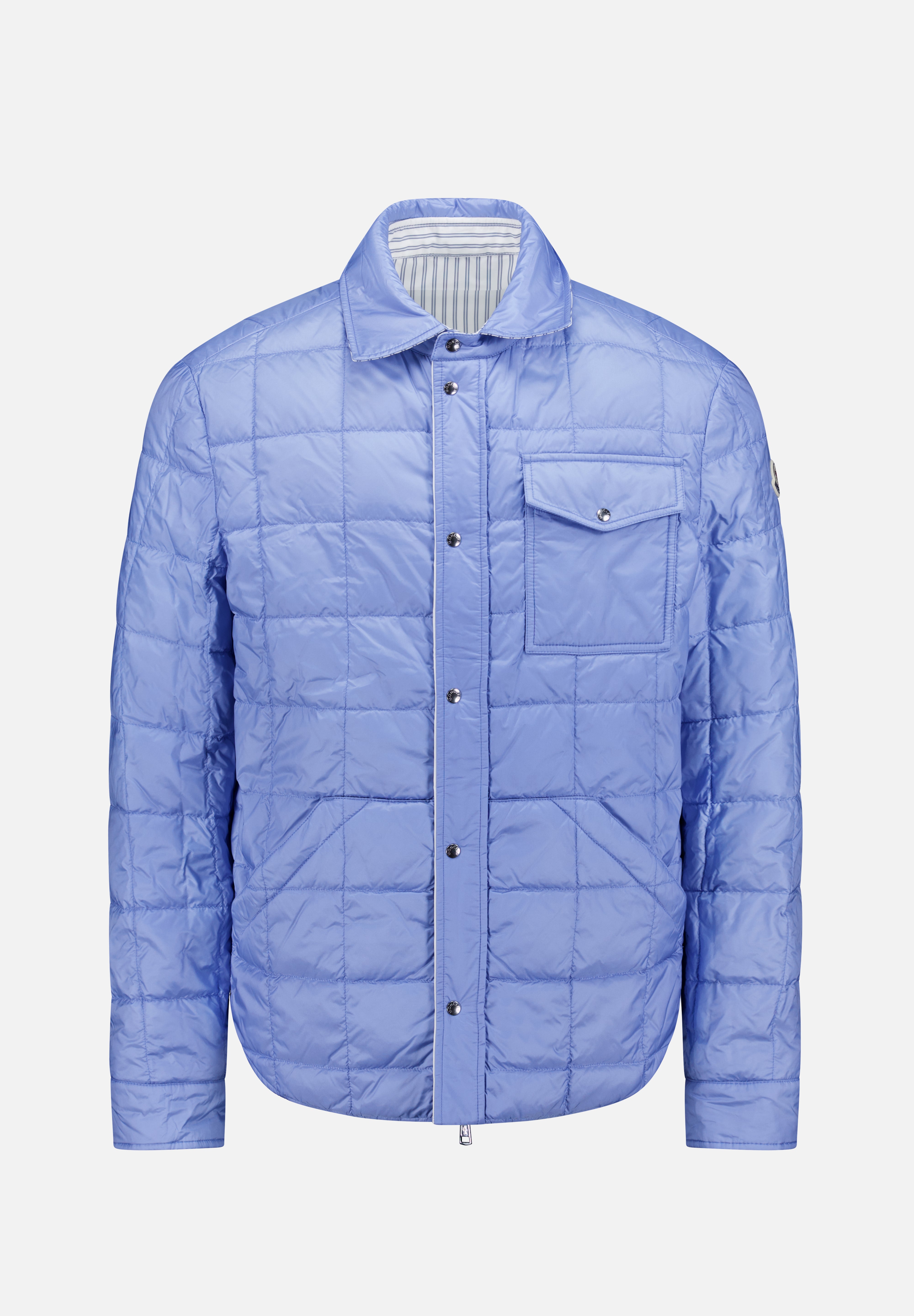 The MONCLER Reversible Crescent Shirt Jacket is a light blue men's outerwear with snap buttons, a collar, long sleeves, a chest pocket, subtle grid stitching, and a slight sheen.