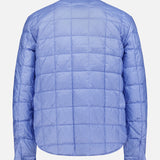The MONCLER Reversible Crescent Shirt Jacket features light blue quilted fabric with a grid pattern, long sleeves, buttoned cuffs, and a short collar—shown from the back on a plain white background.