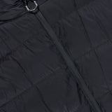 Close-up of the MONCLER Fleeced Chest Pocket Vest, a true cold-weather staple, featuring horizontal stitching, a smooth zipper partially closed, and a small metallic ring attached to the zipper pull.