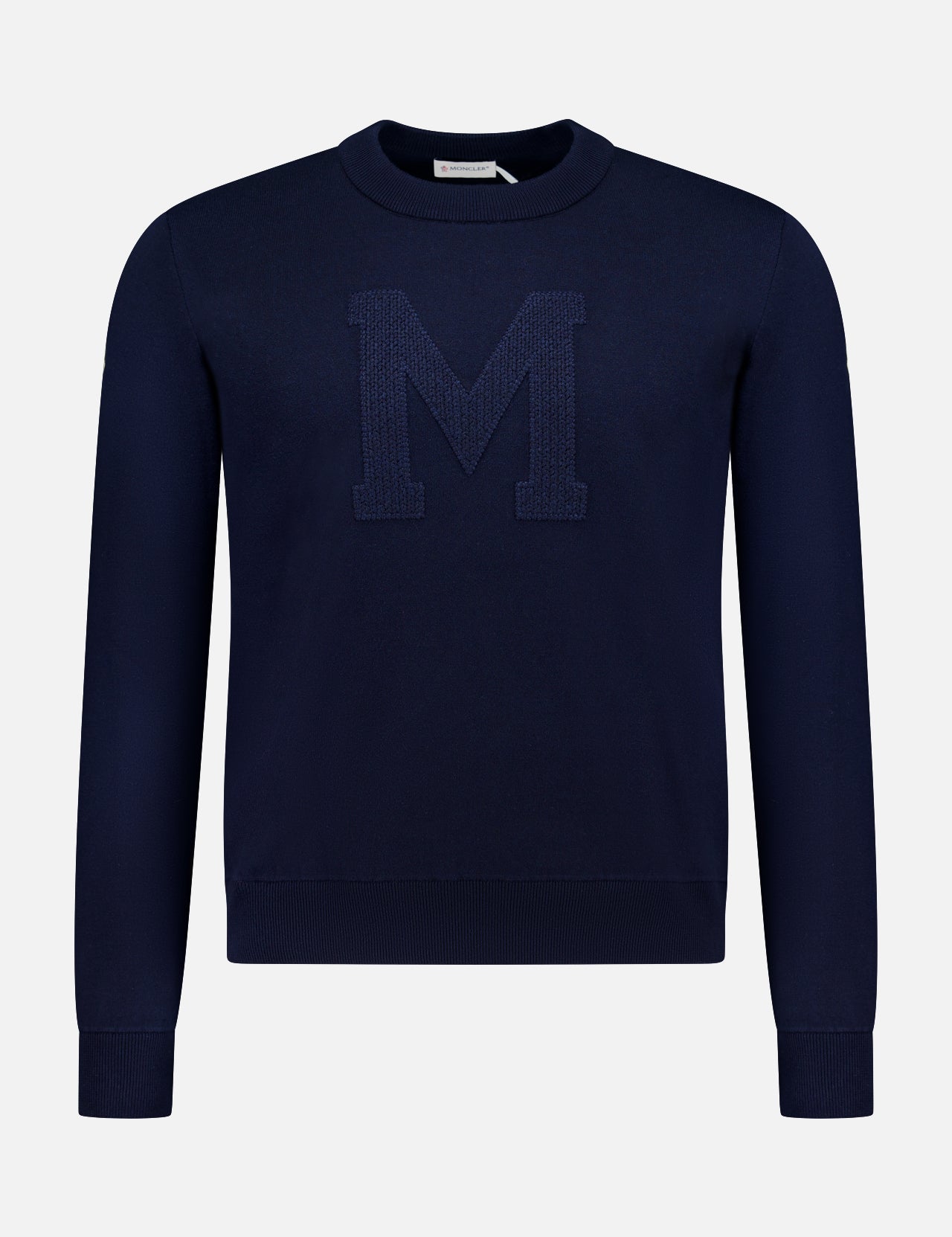 This MONCLER Long Sleeve Crewneck T-Shirt for men is navy with a large textured "M" on the front, shown against a plain white background.