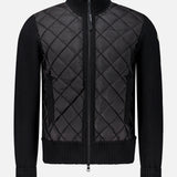 MONCLER Puffer Zipped Up Jacket in black with a diamond quilted front panel and ribbed knit sleeves, collar, and hem.