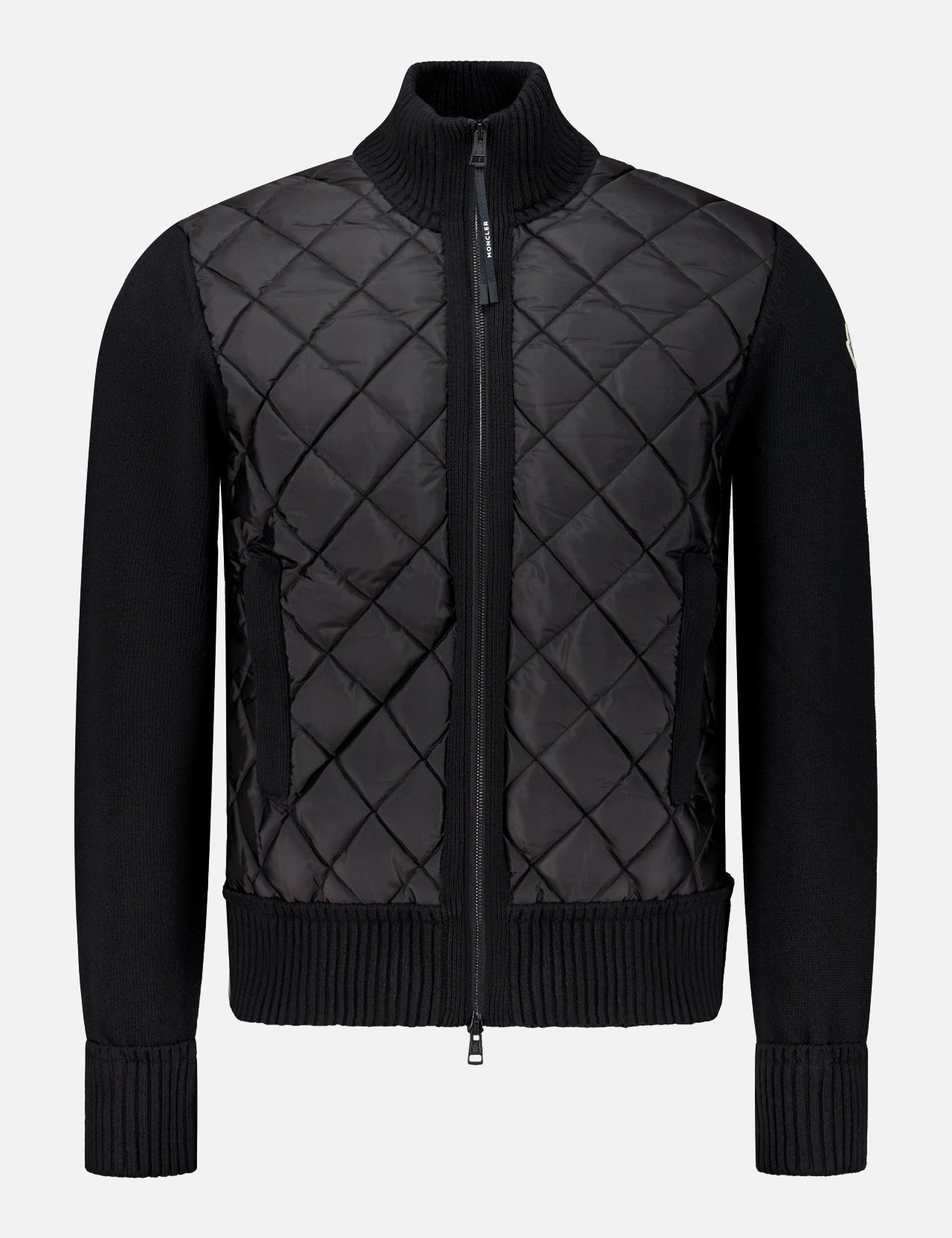 MONCLER Puffer Zipped Up Jacket in black with a diamond quilted front panel and ribbed knit sleeves, collar, and hem.