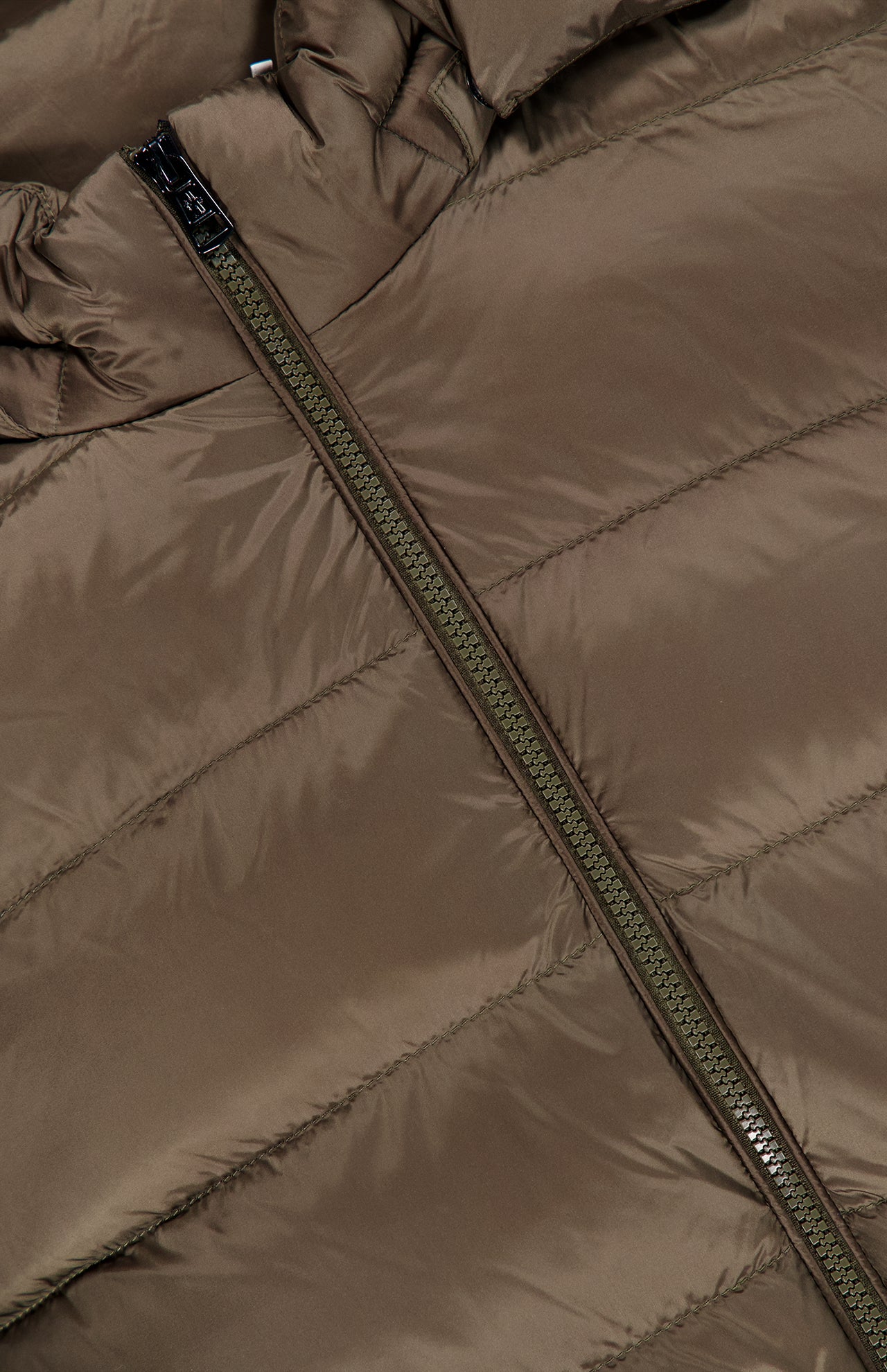 Close-up of the MONCLER Ravenlock Removable Hood Puffer Jacket in brown, crafted from lightweight nylon with visible horizontal quilting and a partially unzipped diagonal zipper.