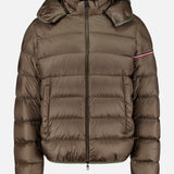 The Ravenlock Removable Hood Puffer Jacket by MONCLER is a brown down jacket featuring a hood, front zipper closure, horizontal quilting, and a subtle red and white stripe detail on the upper left sleeve. Crafted from lightweight nylon for comfort and versatility.