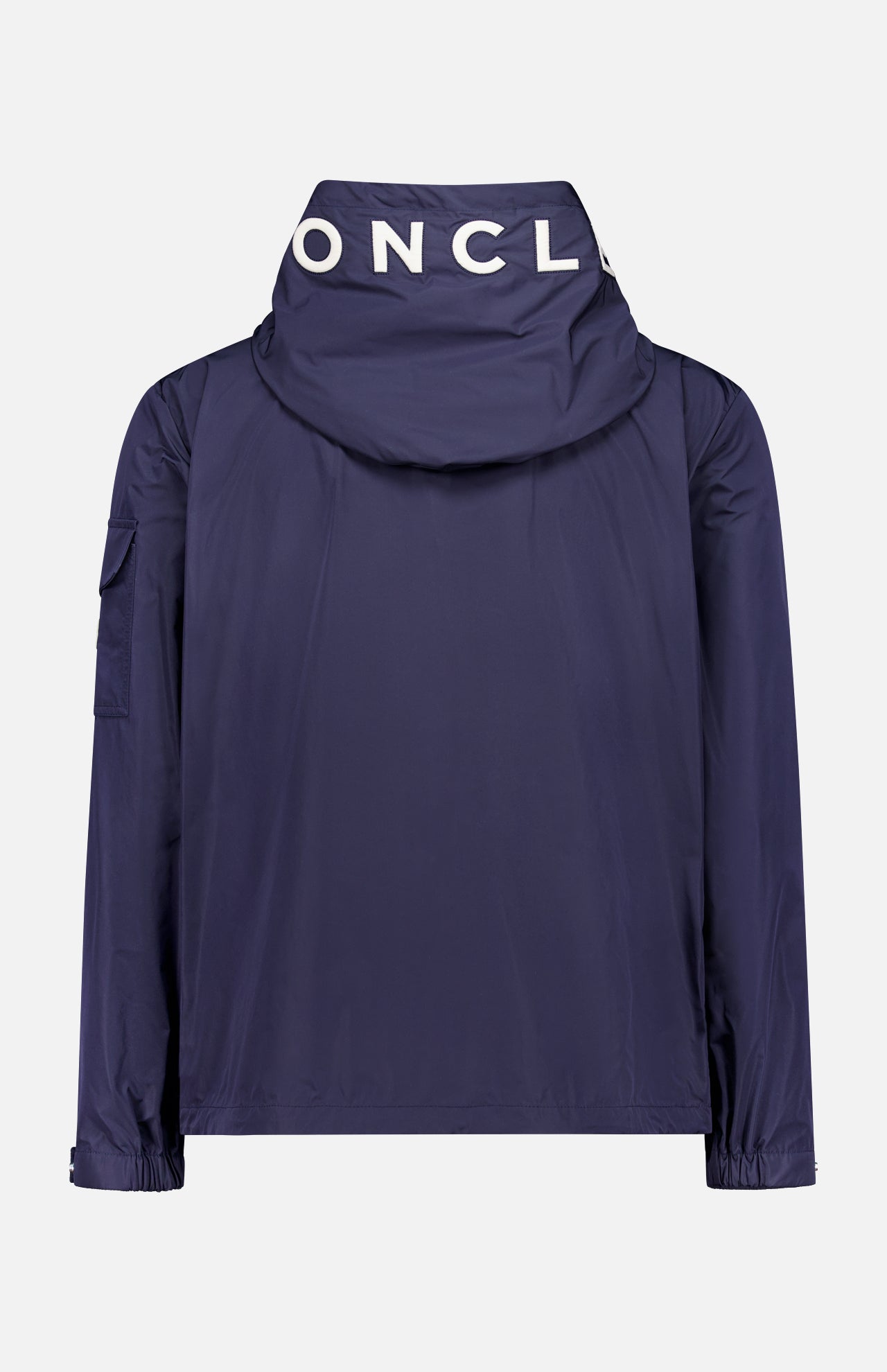 The MONCLER Sassiere Logo Hood Jacket in navy blue is shown from the back, featuring a bold white MONCL logo on the hood, elastic cuffs, and a pocket on the left sleeve.