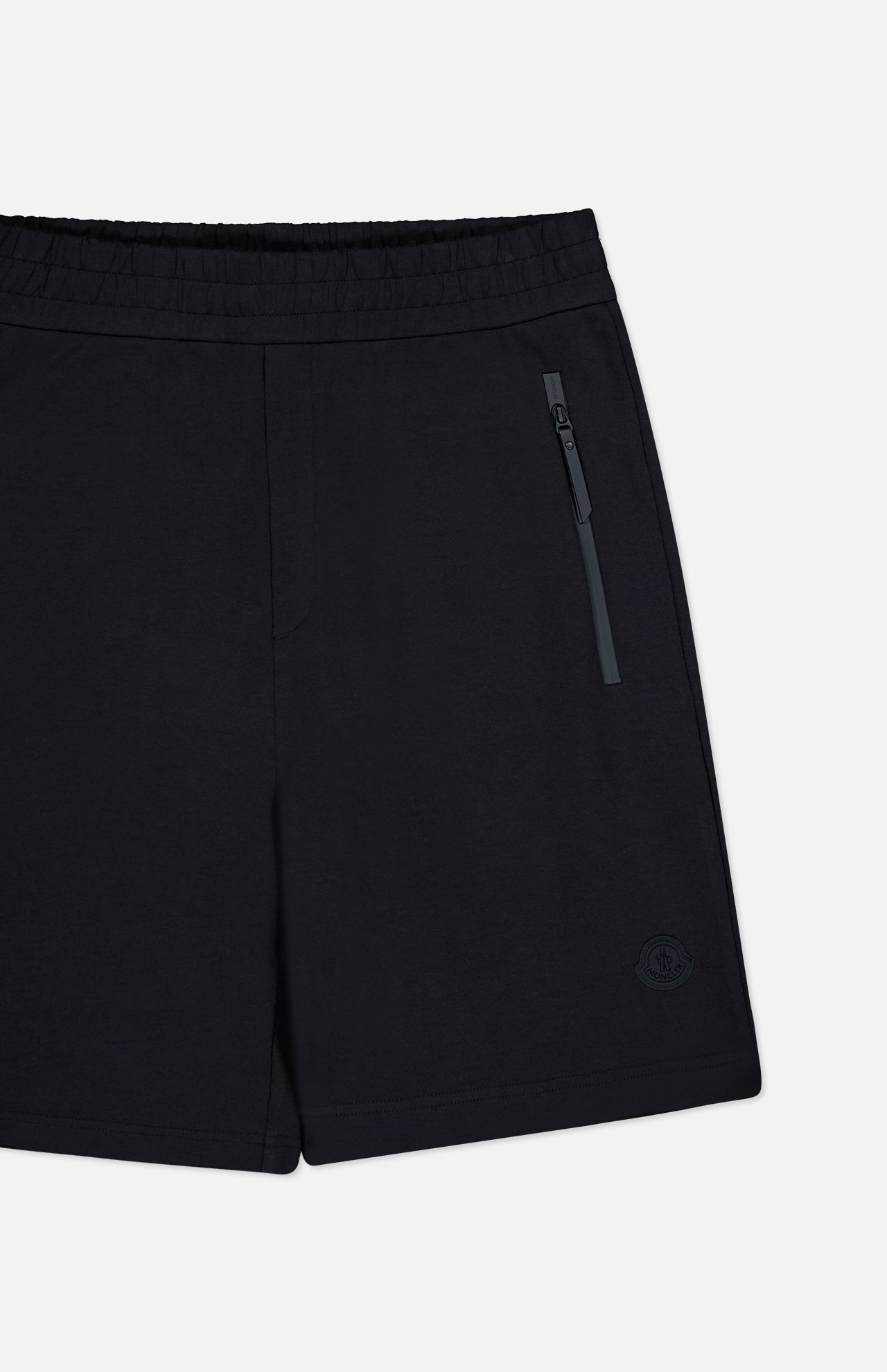 MONCLER Zip Pocket Drawstring Shorts in black double face cotton feature an elastic waistband, a zippered side pocket, and a small logo on the lower left leg, shown on a plain white background.