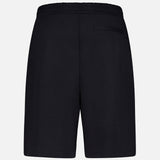 Back view of MONCLER Zip Pocket Drawstring Shorts in plain black, featuring an elastic waistband and right-side zip back pocket, crafted from double face cotton, shown against a white background.