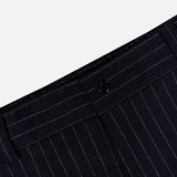 Close-up of the waistband and upper section of MONCLER Striped Drawstring Trousers against a light background, showcasing the button closure and crisp vertical stripes for a modern take on classic style.