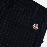 Close-up of MONCLER Striped Drawstring Trousers in dark navy, highlighting a back pocket, belt loops, and a Moncler logo patch above the pocket.