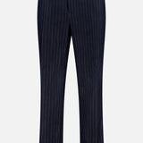 The MONCLER Striped Drawstring Trousers feature dark navy blue fabric with vertical white stripes and a straight-leg fit, displayed on a plain white background.