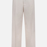 A pair of MONCLER Drawstring Stretch Cotton Trousers in light beige, featuring a straight-leg cut, belt loops, side pockets, and a flat front, shown against a white background.