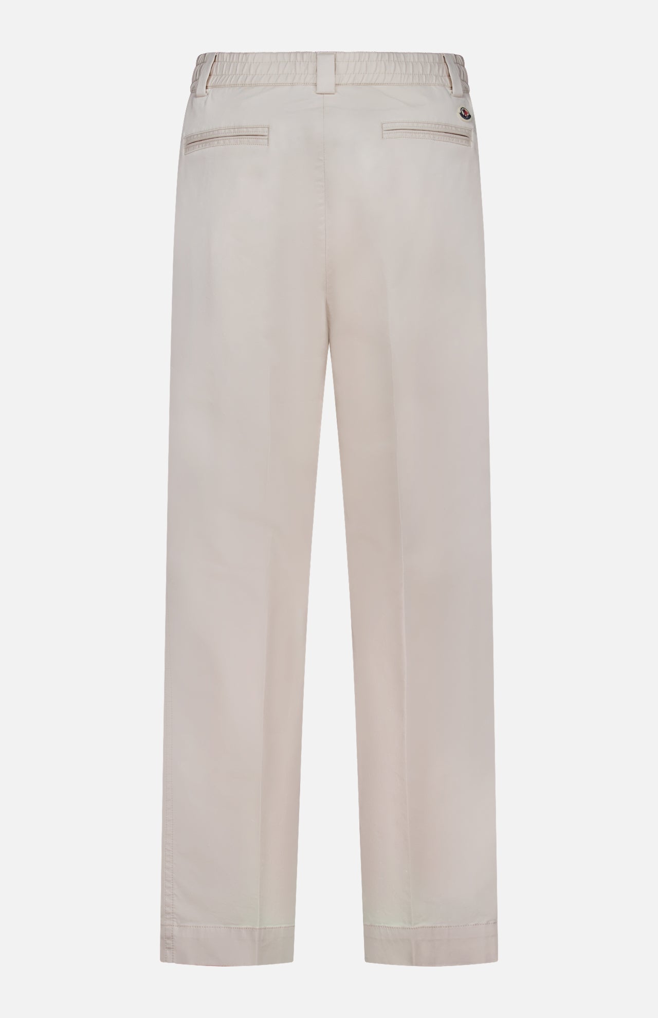 Back view of MONCLER Drawstring Stretch Cotton Trousers in light beige featuring an elastic waistband with drawstring, belt loops, and two back welt pockets—one with a button closure.