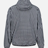 Back view of the MONCLER Vandelli Reversible Plaid Jacket in black and white, featuring a hood, zip-front closure, long sleeves, and an elastic waistband—shown against a plain white background—making it a versatile, lightweight outerwear option perfect for layering.