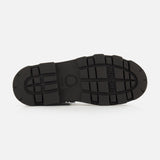 Black rubber sole with a rugged tread pattern, designed for Vera Sheal Ankle Boots by MONCLER. The sole features the MONCLER logo embossed in the center and the brand name near the top right side. Ideal for city living boots, it is shown against a plain white background.