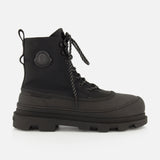 These Vera Sheal Ankle Boots by MONCLER feature black lace-up combat styling with a thick, chunky sole, a round toe, and the signature Moncler logo patch on the ankle. With a cozy fleece interior, these boots are the perfect blend of comfort and style for city living.