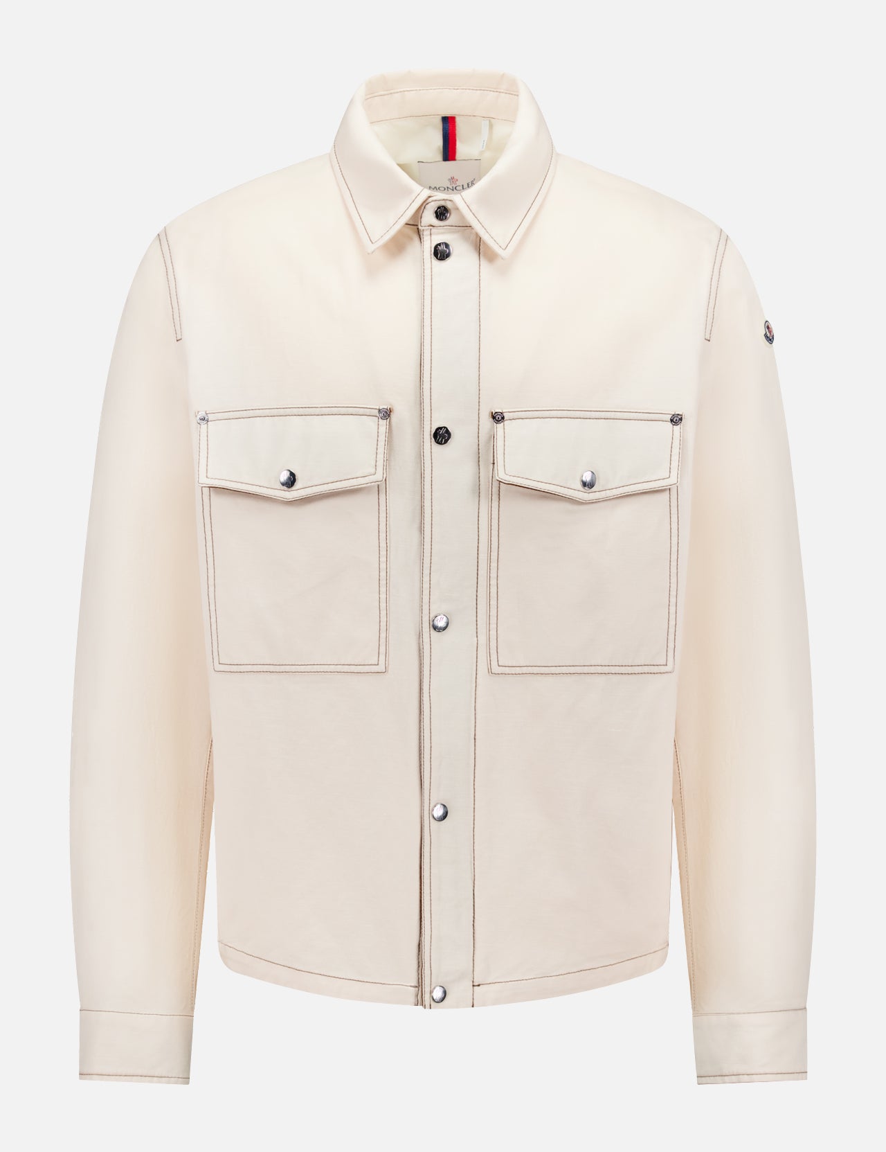 The MONCLER Watagua Water-repellent Shirt Jacket features a cream linen-cotton blend, long sleeves, classic collar, two front flap chest pockets, silver buttons, and dark stitching details, shown on a white background.
