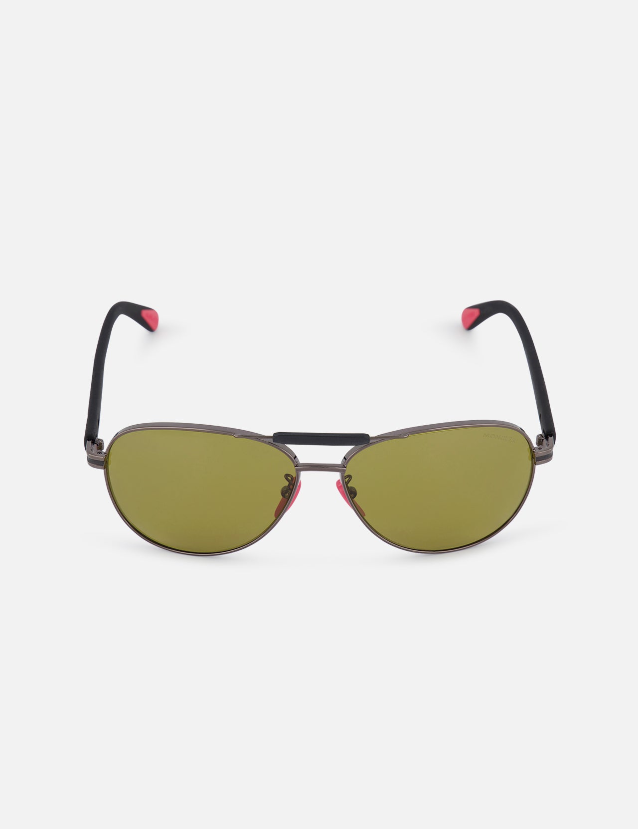 The MONCLER Steller Sunglasses feature green smoky lenses, black frames with a double bridge, and black arms tipped in pink—shown against a white background.