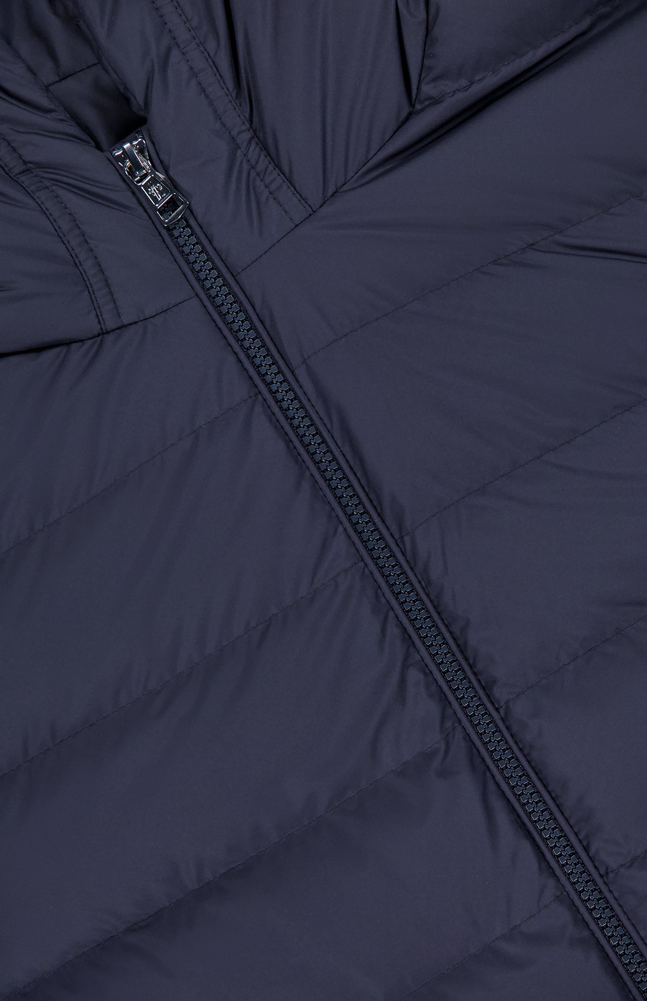 Close-up of the MONCLER Vermeille Hooded Puffer Jacket in navy blue, showing horizontal quilting and a black central zipper.