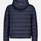 The MONCLER Vermeille Hooded Puffer Jacket in navy blue features horizontal quilting and a hood, displayed from the back against a plain white background.