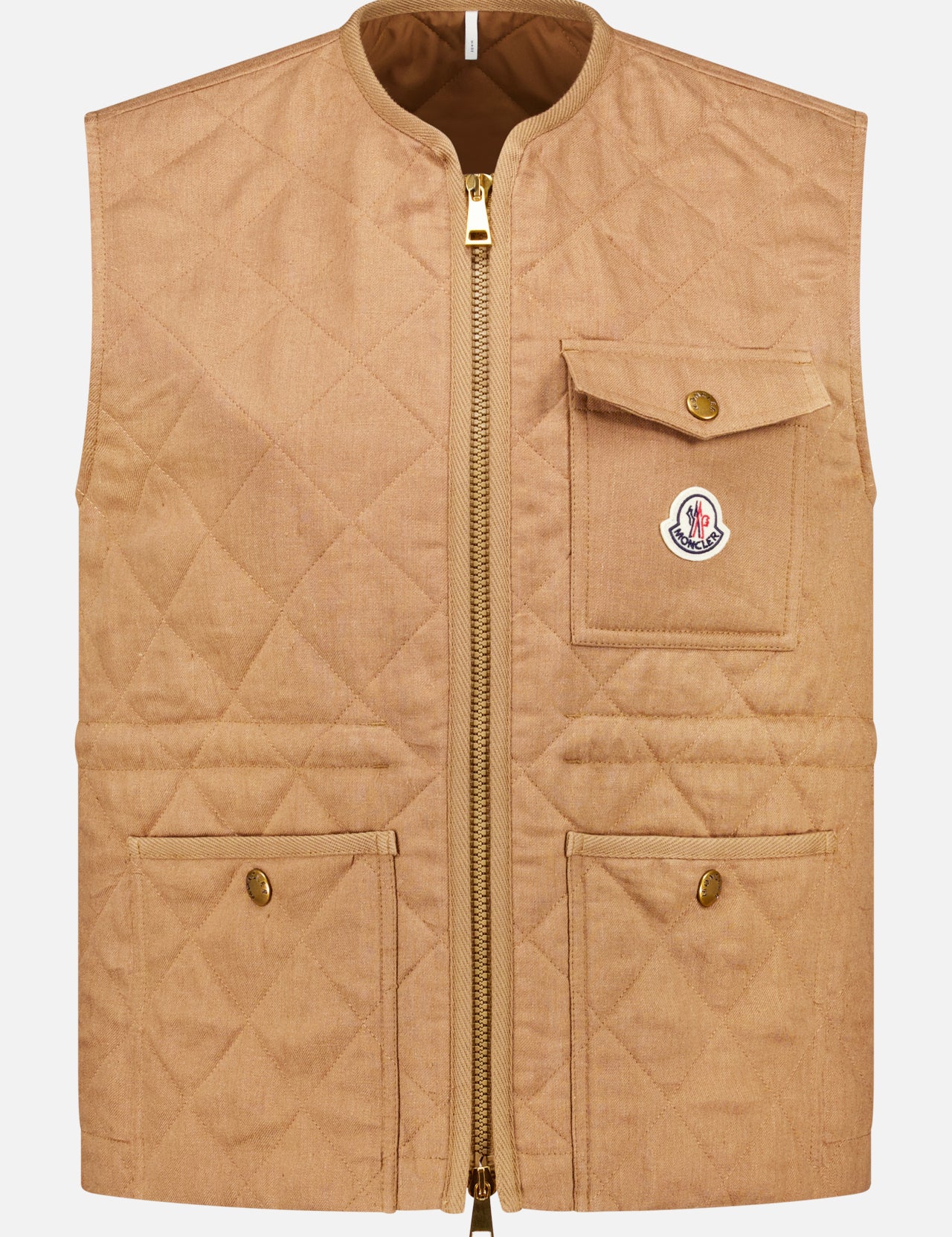 The MONCLER Vigny Linen Sleeveless Jacket is a tan quilted vest with a front zipper, three flap pockets with gold snaps, and a small logo patch on the upper chest pocket.