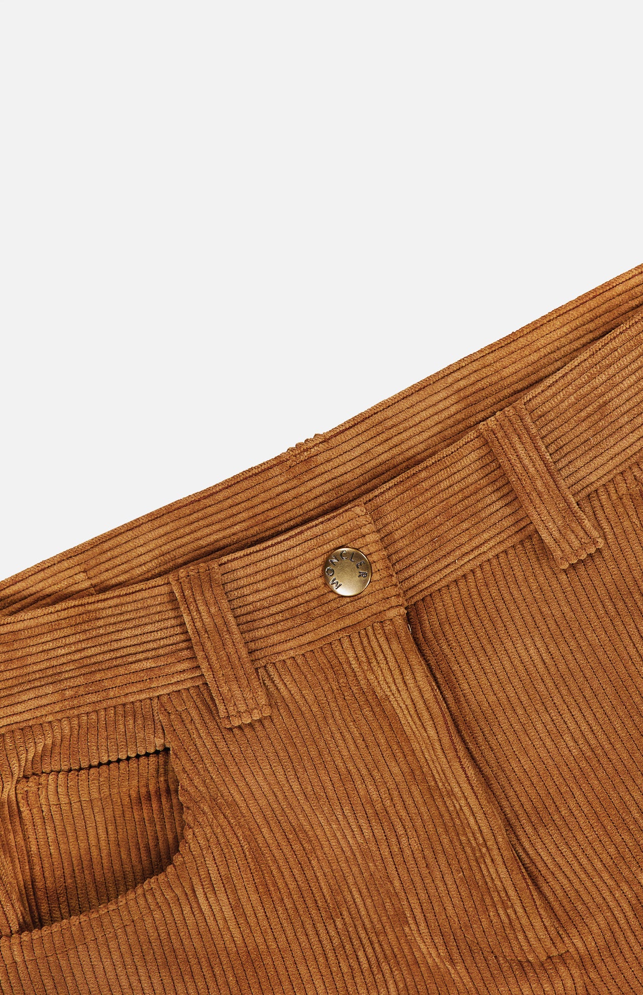 Close-up of the waistband and front pocket of MONCLER Corduroy 5-Pocket Trousers, showcasing belt loops, a metal button, and rich corduroy texture—perfect for men’s fall style against a white background.