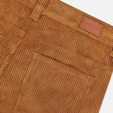 Close-up of MONCLER Corduroy 5-Pocket Trousers, featuring the back pocket, belt loops, and a brown leather MONCLER patch above the pocket.