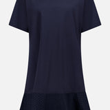 The MONCLER Embroidered Hem Mini Dress is a navy, short-sleeve cotton mini with a round neckline, relaxed fit, flared hem, and subtle embroidery near the bottom for chic summer style. No visible fastenings or embellishments.