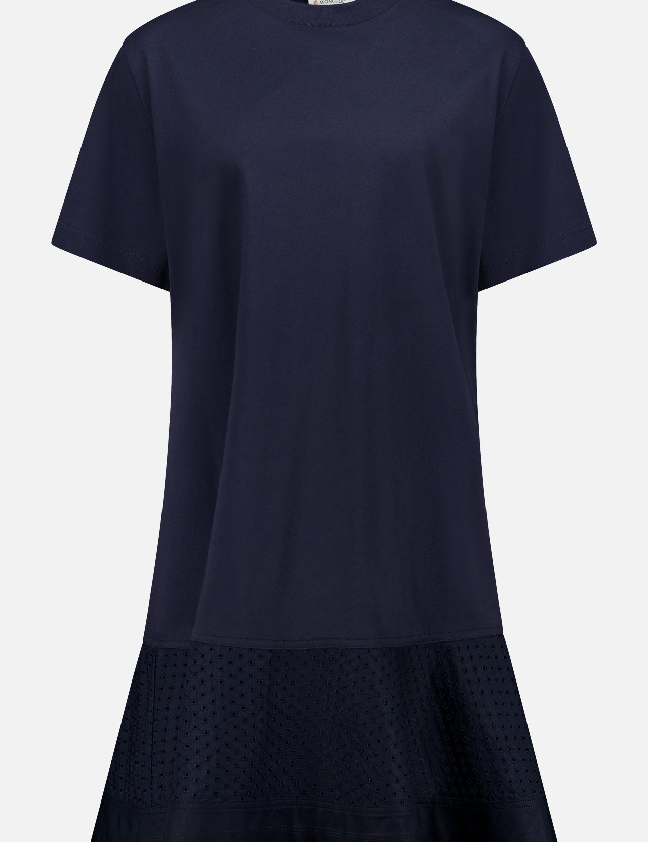 The MONCLER Embroidered Hem Mini Dress is a navy, short-sleeve cotton mini with a round neckline, relaxed fit, flared hem, and subtle embroidery near the bottom for chic summer style. No visible fastenings or embellishments.