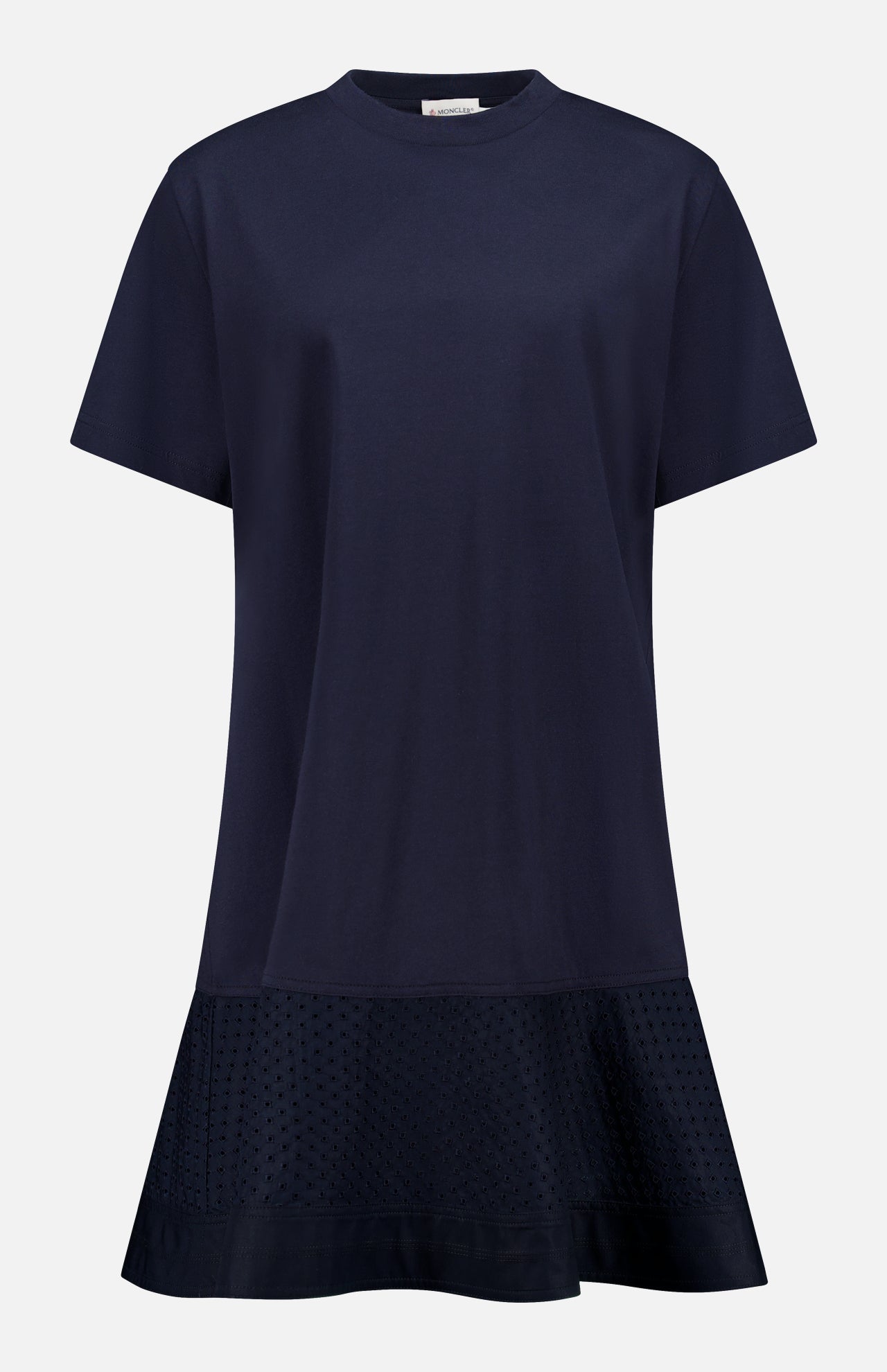 The MONCLER Embroidered Hem Mini Dress is a navy, short-sleeve cotton mini with a round neckline, relaxed fit, flared hem, and subtle embroidery near the bottom for chic summer style. No visible fastenings or embellishments.