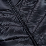 Close-up view of the MONCLER Extrafine Wool Cardigan, showcasing its sleek, quilted design with stitched horizontal lines and a visible diagonal zipper.