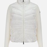 A white MONCLER Extrafine Wool Cardigan Jacket featuring a high collar, front zipper, and ribbed knit sleeves is displayed against a plain light background.