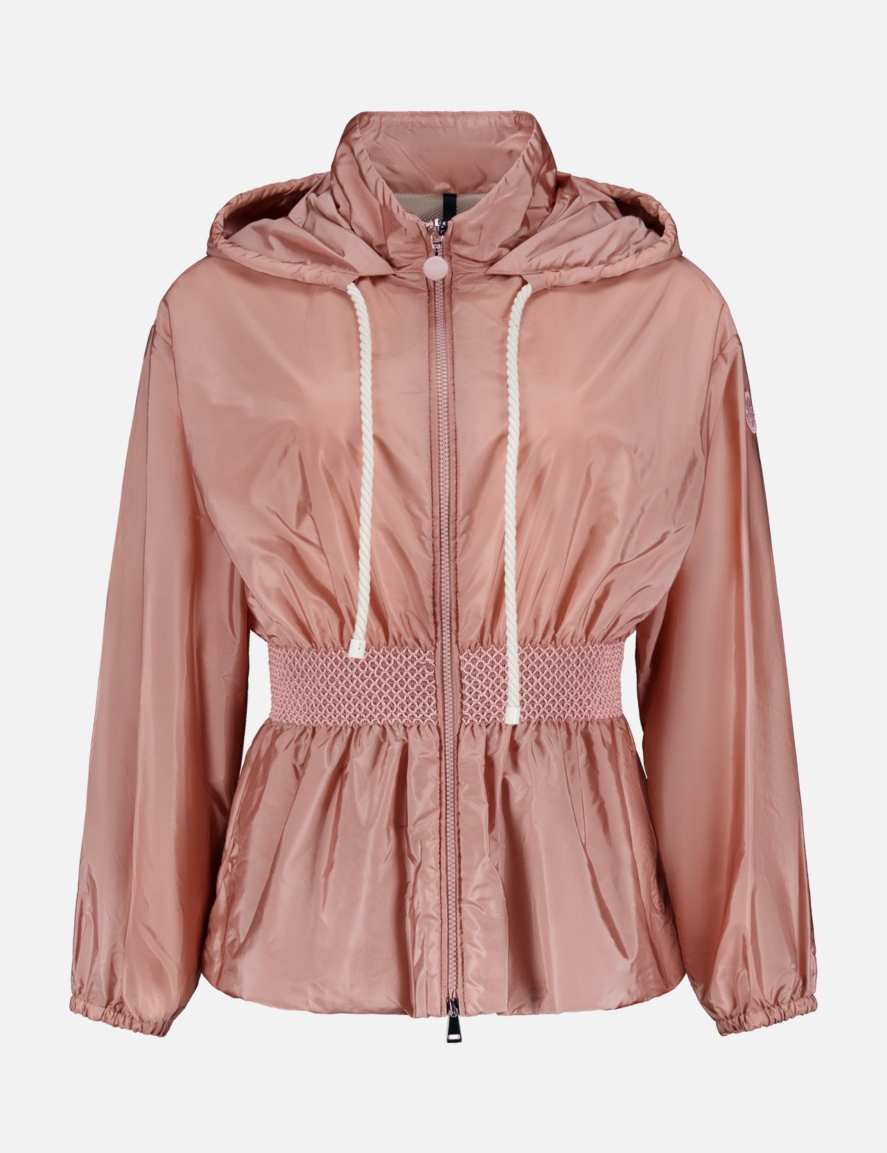 The MONCLER Liriope Hooded Rain Jacket in light pink features a shiny finish, front zipper, white drawstrings, smocked elastic waist, and long sleeves with elastic cuffs. Shown against a plain white background. High-performance outerwear at its finest.