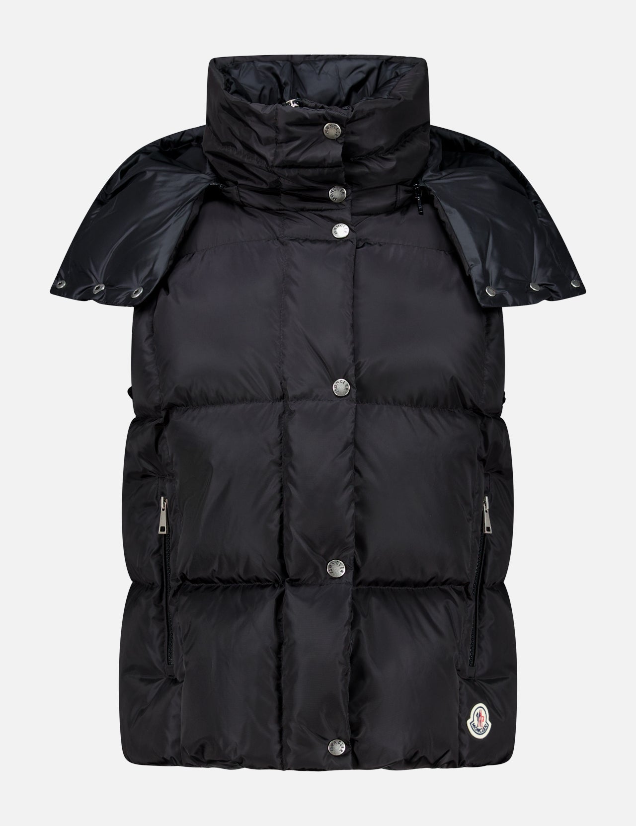 The MONCLER Macareux Down Puffer Vest, shown in black against a white background, features a high collar, snap buttons, zippered side pockets, and a subtle logo patch near the hem. This stylish vest offers water-repellent down outerwear ideal for chilly days.